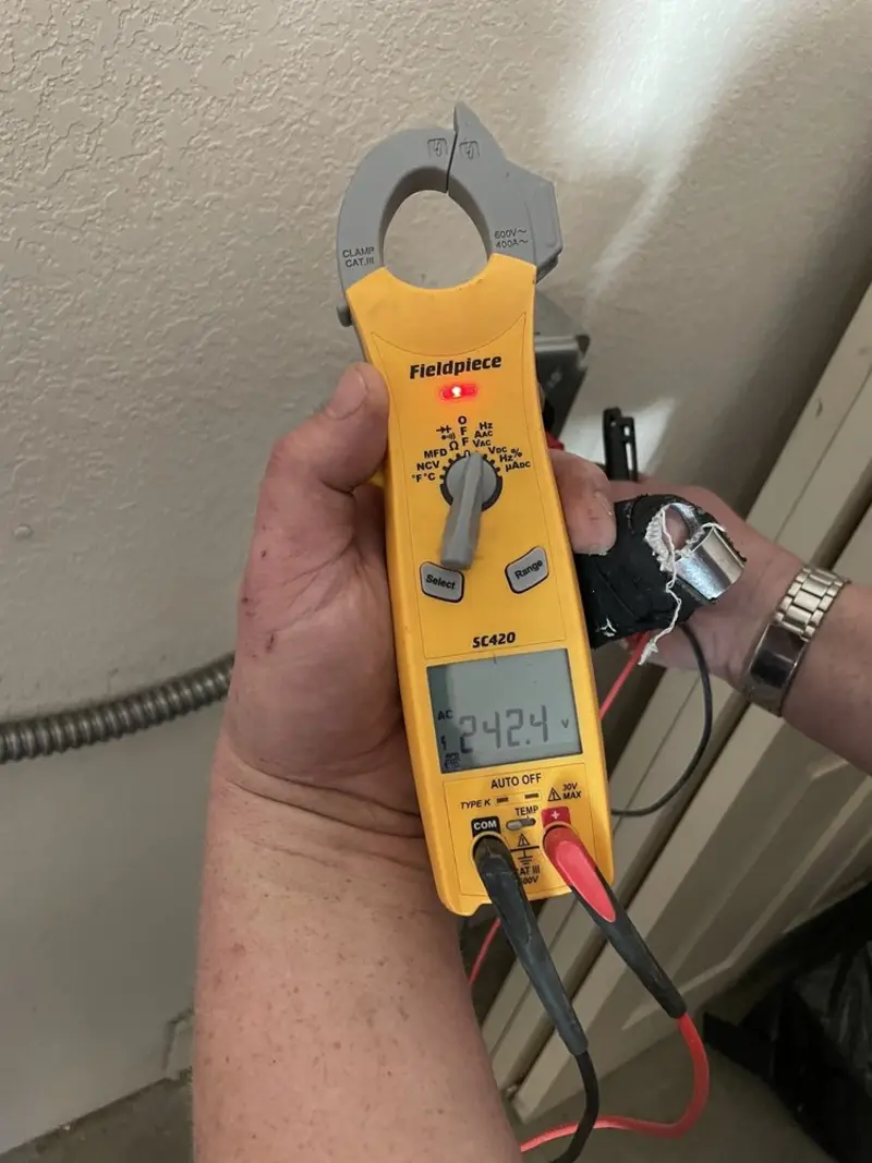 Voltage testing with clamp meter during Recessed Lighting Installation in Sallisaw